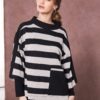 Model wearing NAYA high neck striped top with wide black and grey horizontal stripes, contrast pocket detail, and relaxed sleeves, posing against a muted pink backdrop.